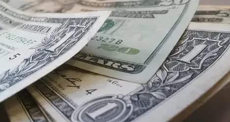 Dollar notes representing forex profits from scalping strategy